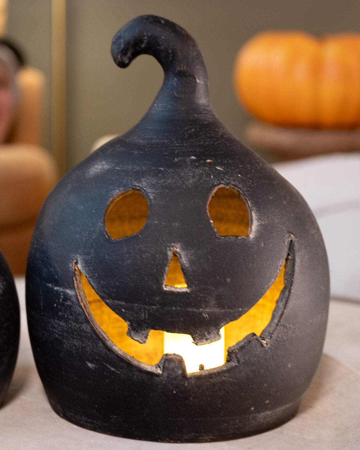 SET OF TWO BLACK CLAY JACK-O-LANTERNS